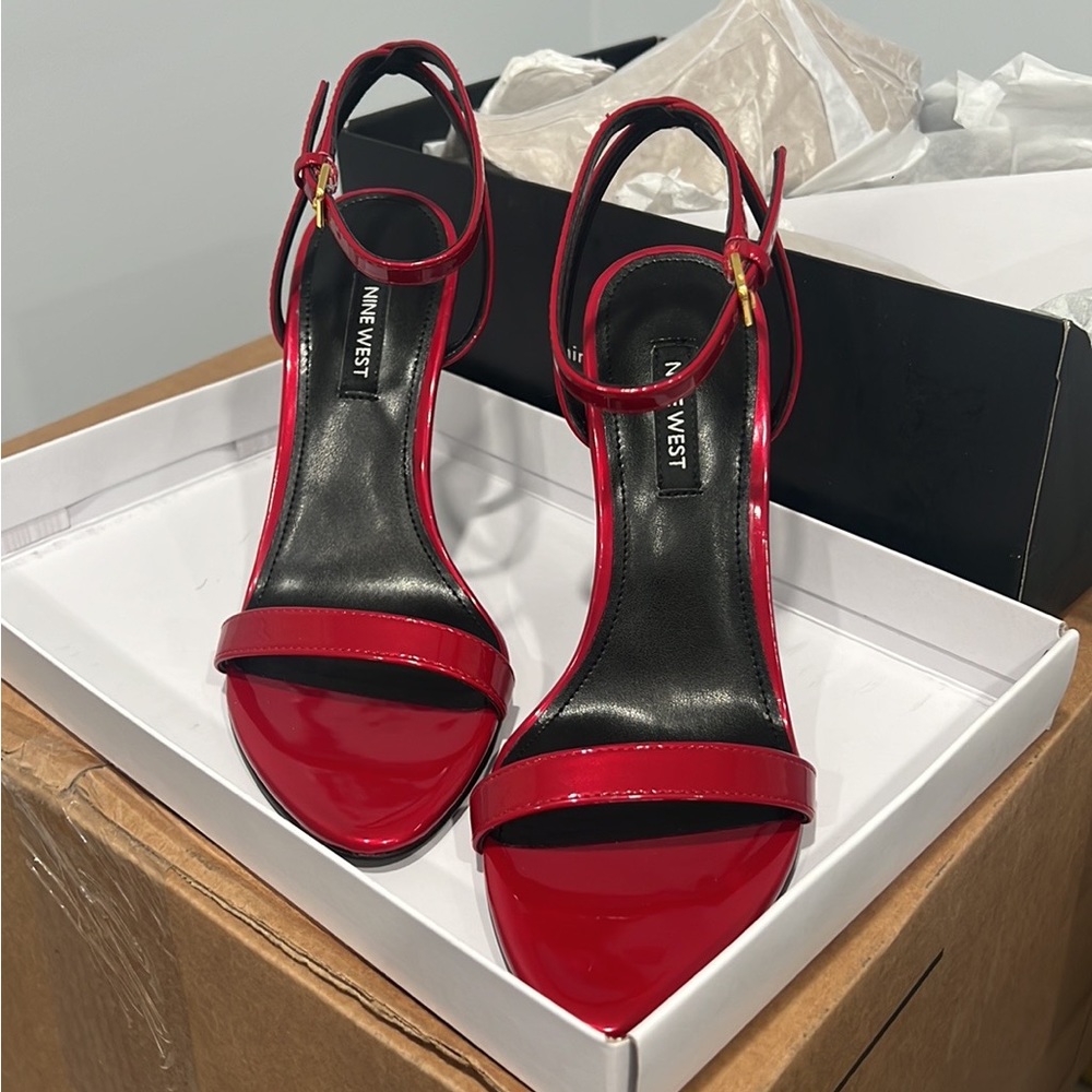 Brand new in box. Never worn. Red Nine West Reina heel sandal.